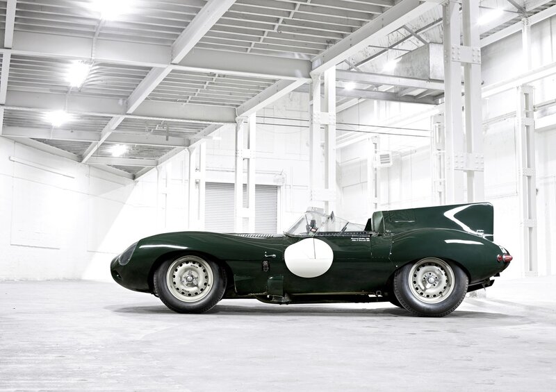 Green racing car in warehouse