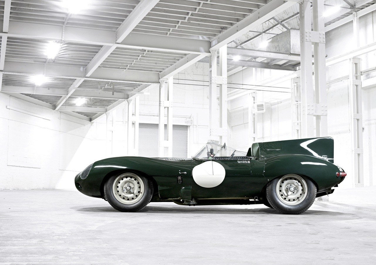 Green racing car in warehouse