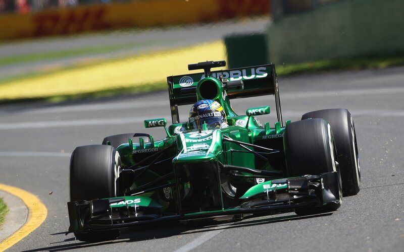 Green racing car on track