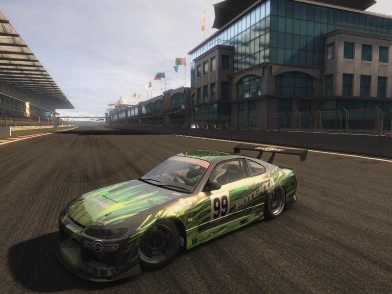 green racing car on track