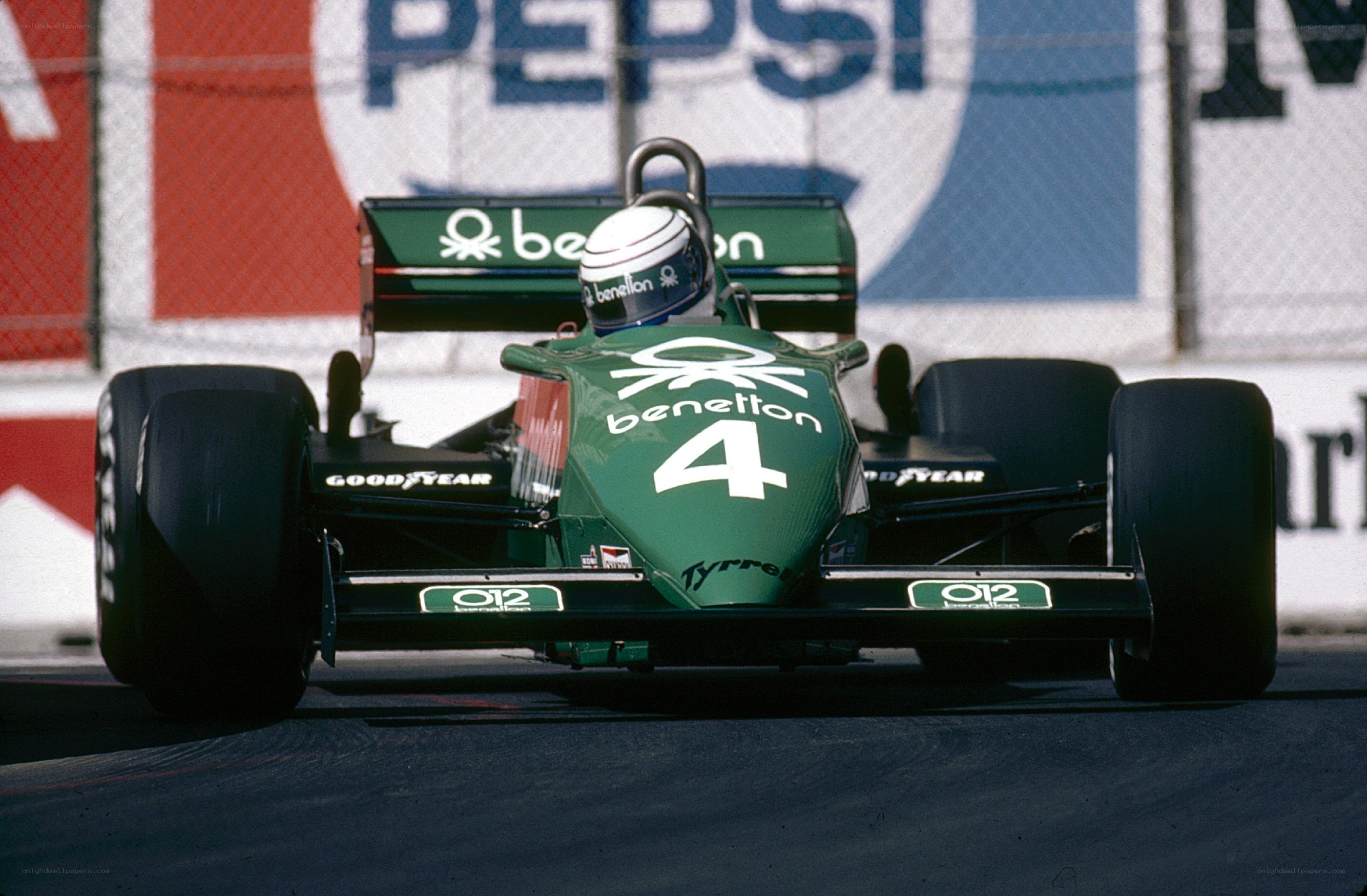 Green racing car on track
