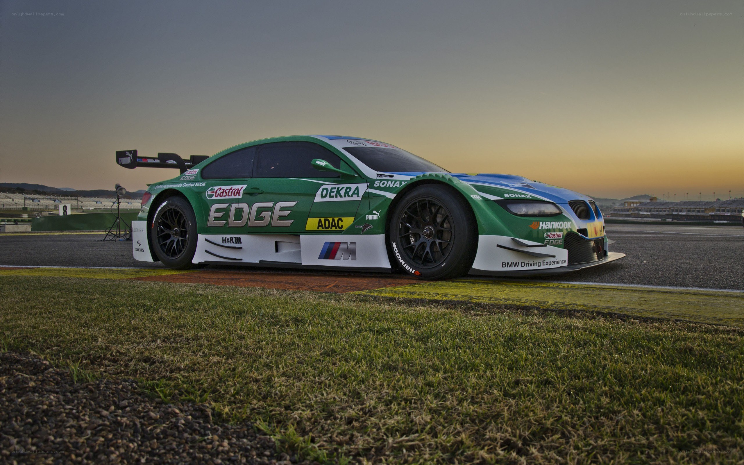 green racing car on track