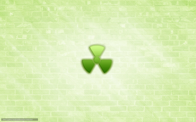 green radiation symbol on brick wall