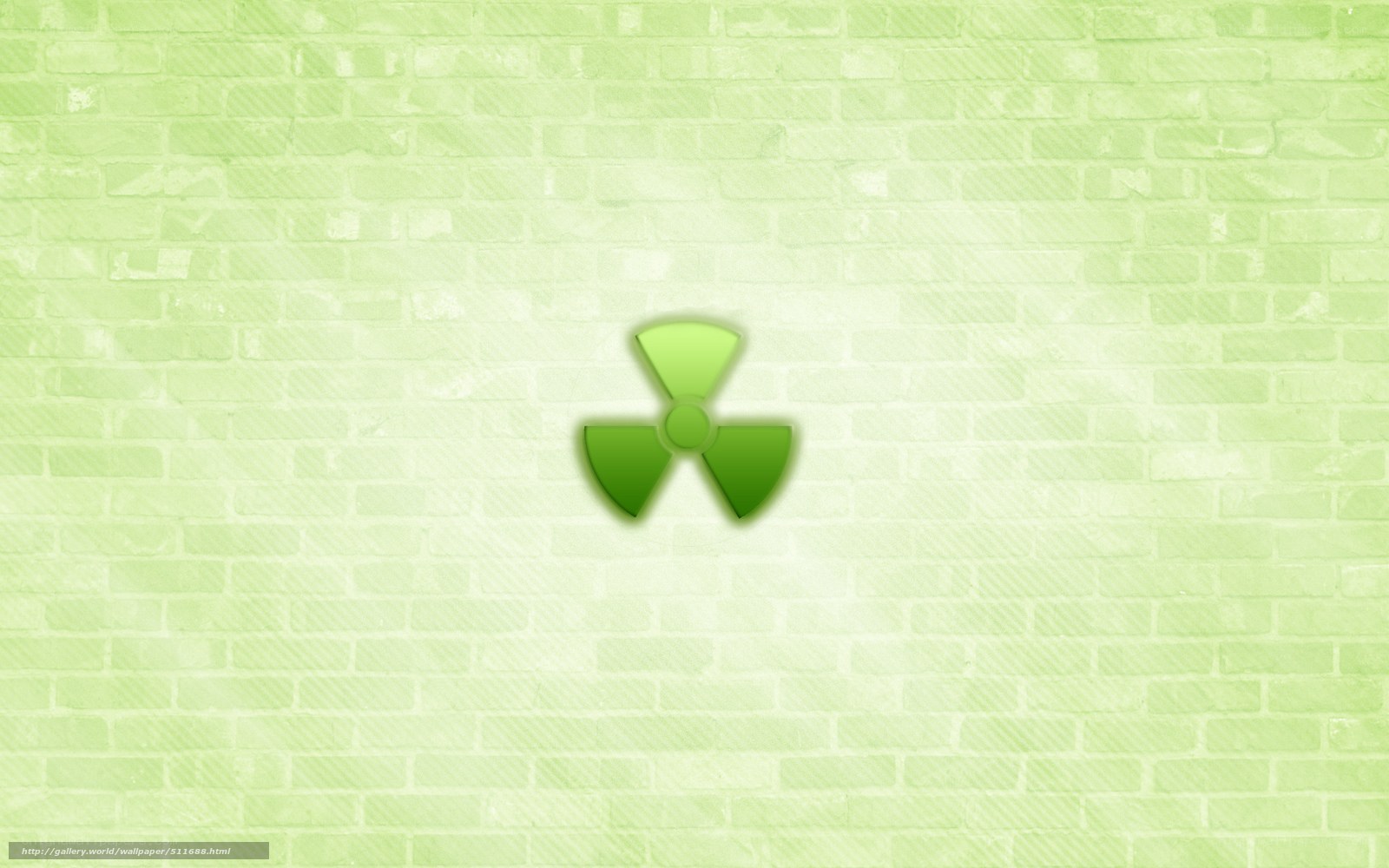 green radiation symbol on brick wall