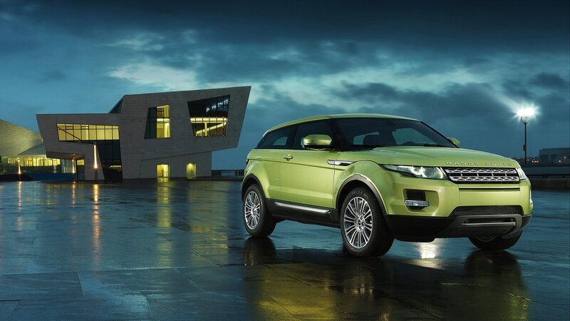 Green Range Rover in modern setting