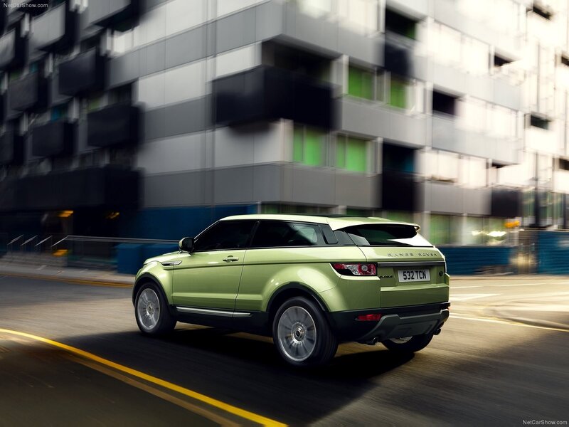 Green Range Rover in motion