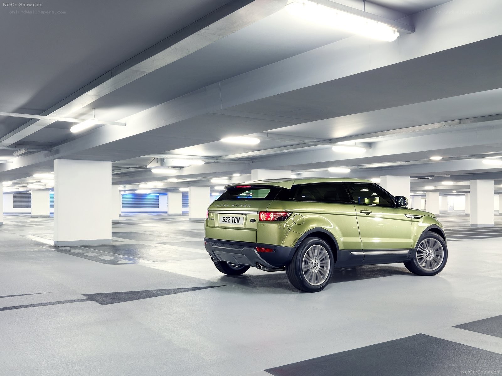 Green Range Rover in parking garage