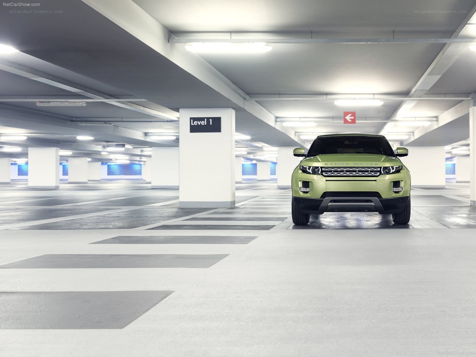 Green Range Rover in parking garage