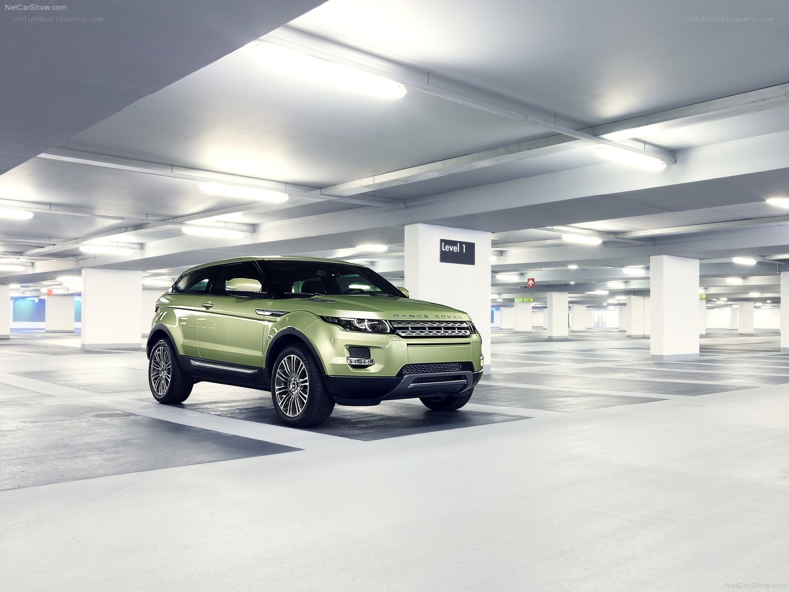 Green Range Rover in parking garage