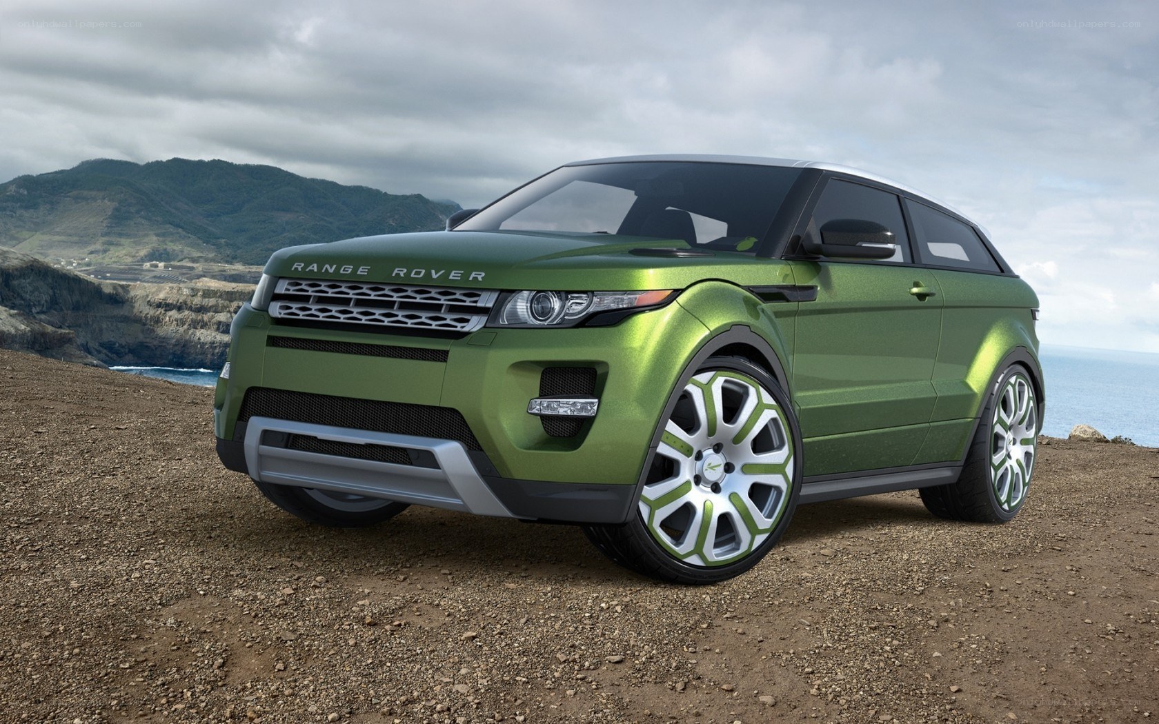 Green Range Rover on cliff