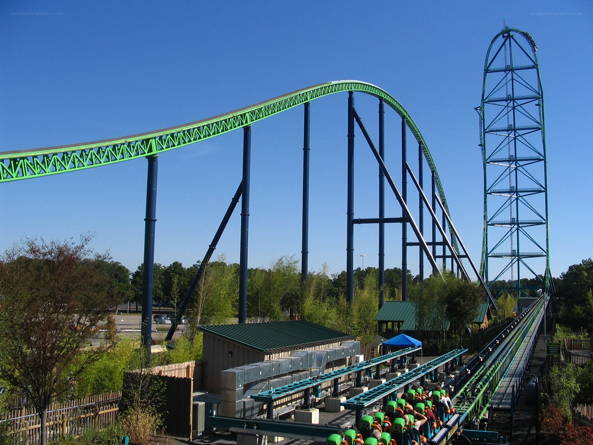 Green roller coaster at amusement park