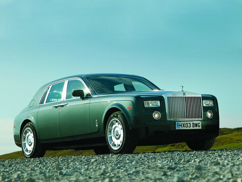Green Rolls-Royce on gravel