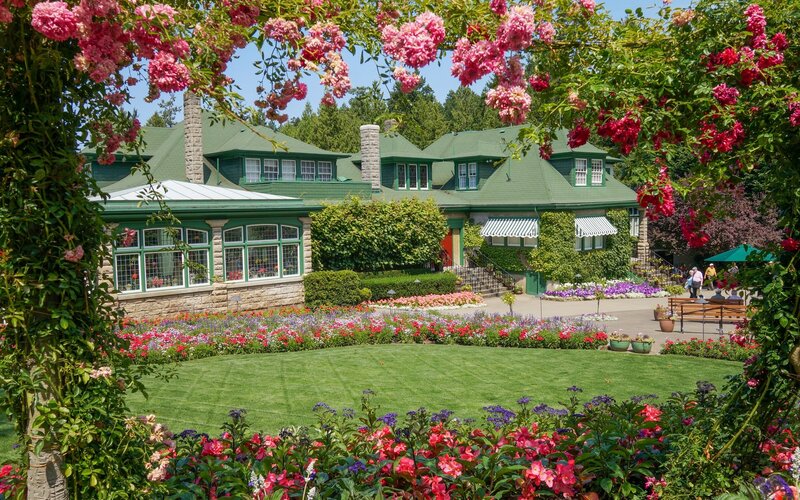 Green-roofed House with Flowers
