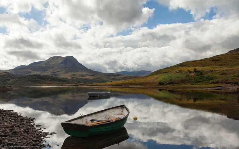 Green Rowboat on Lake — Blue