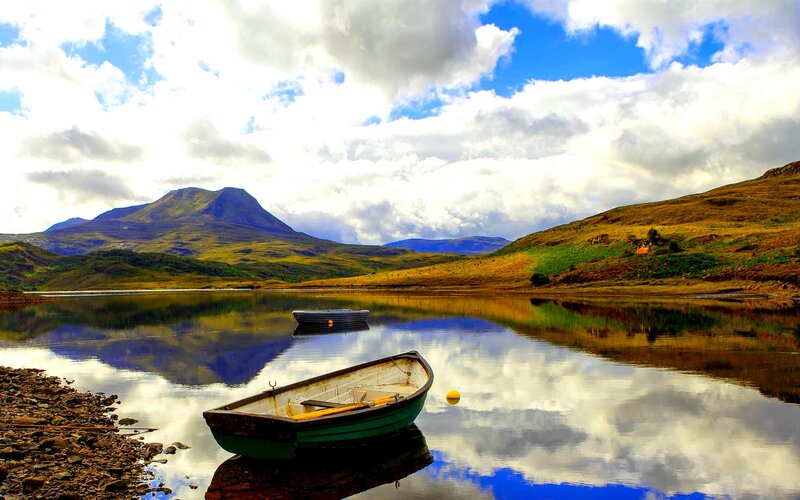 Green Rowboat on Lake