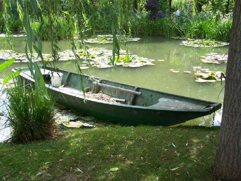 Green Rowboat on Pond