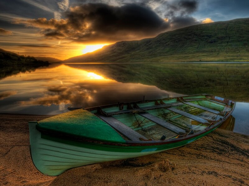 Green Rowboat on Shore