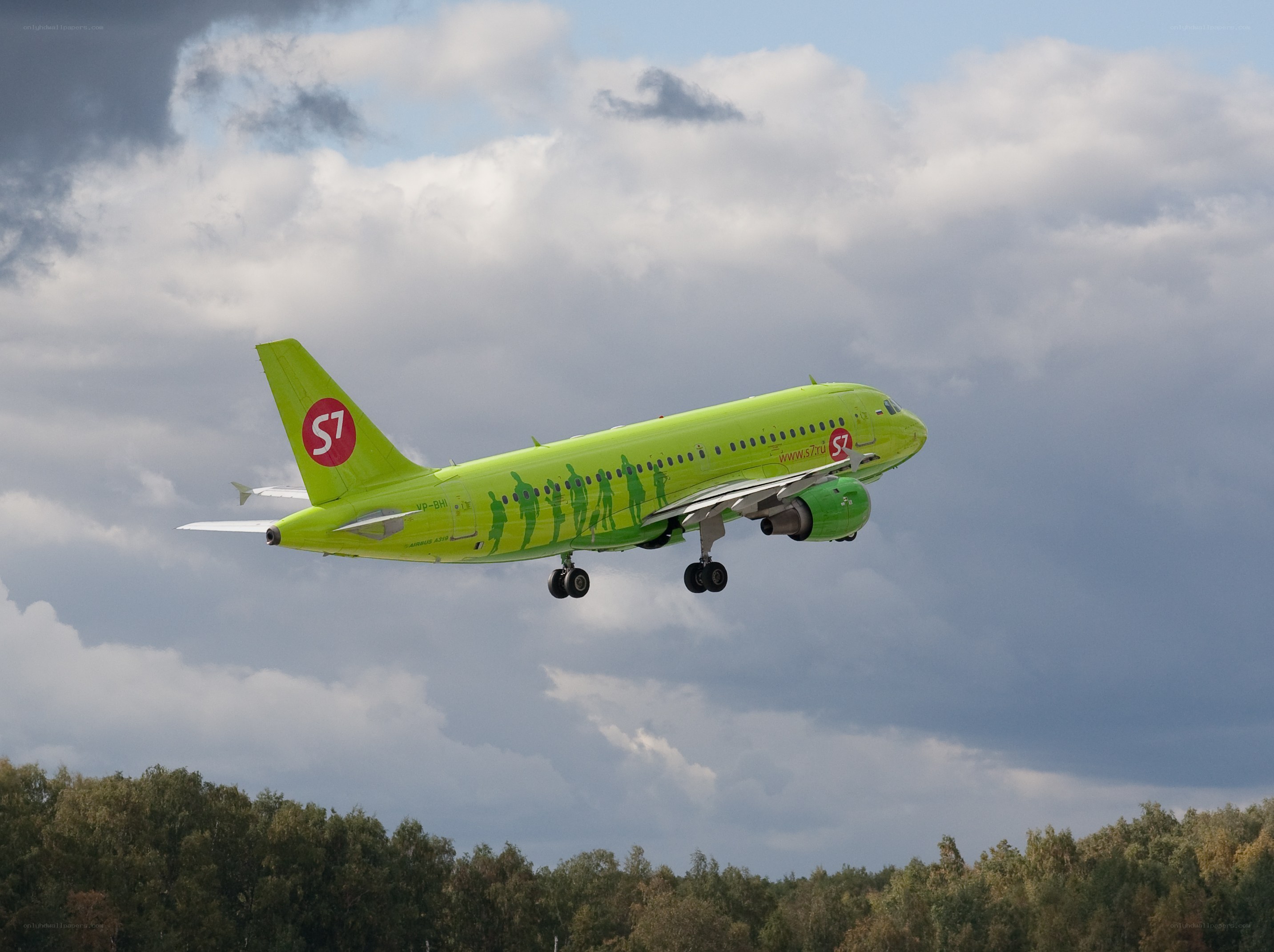 Green S7 Airlines plane in flight