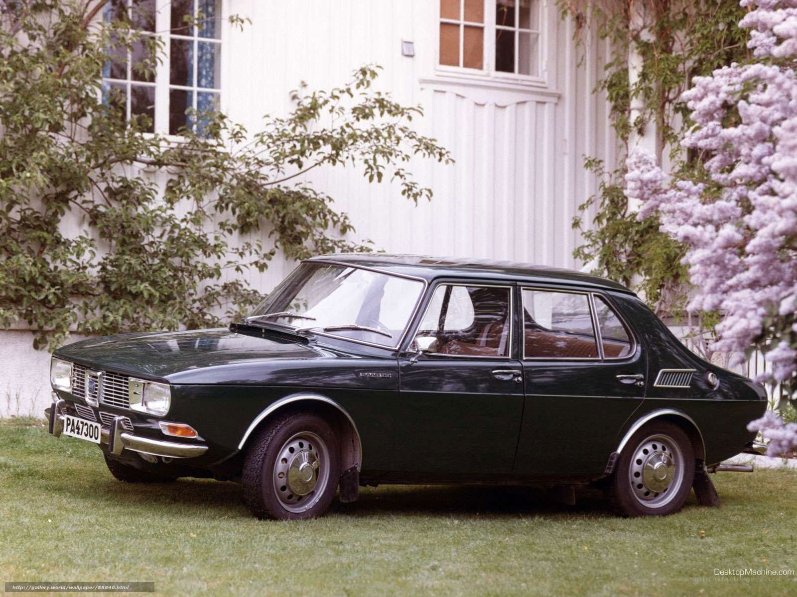 Green Saab 99 parked in garden