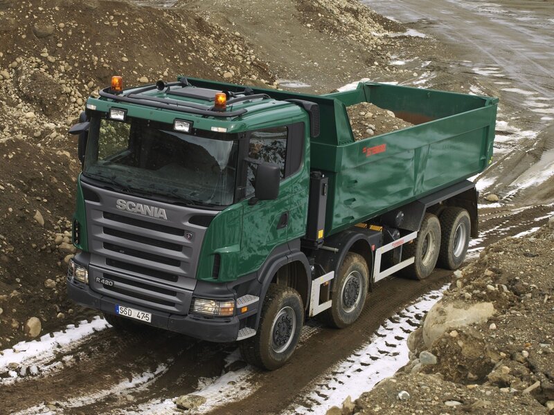 Green Scania dump truck on construction site