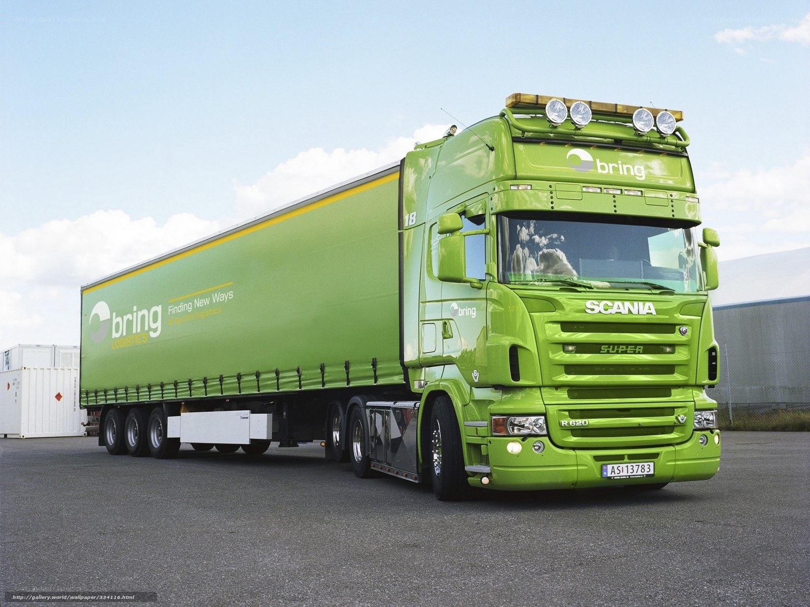 Green Scania truck with trailer