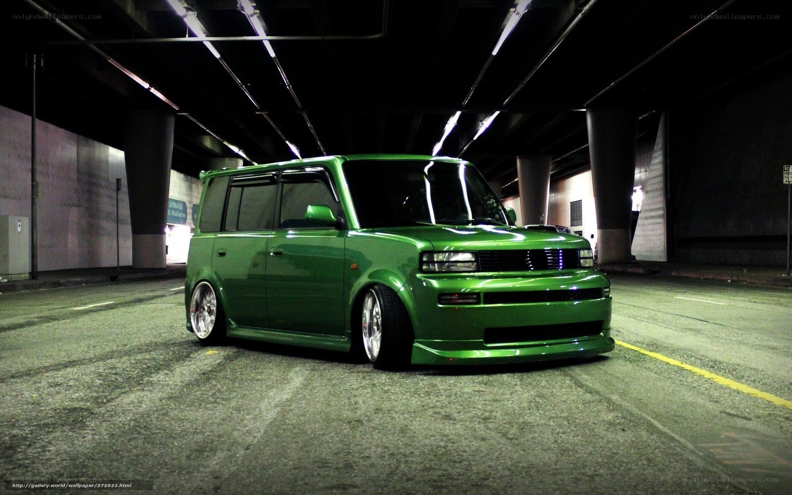 Green Scion xB in parking garage
