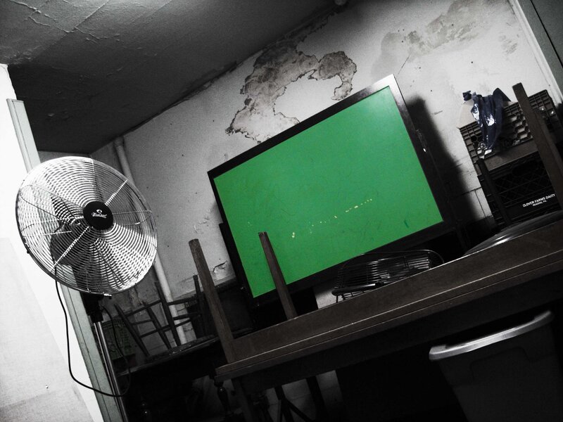 green screen in a cluttered room