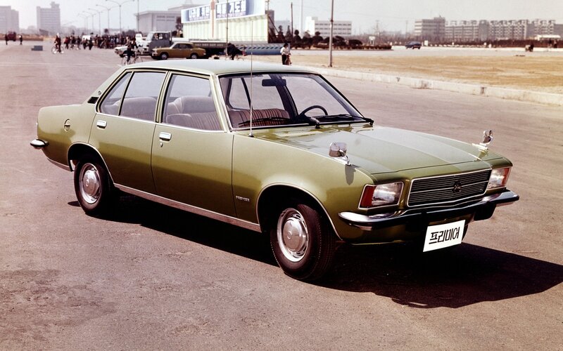 Green sedan car on display