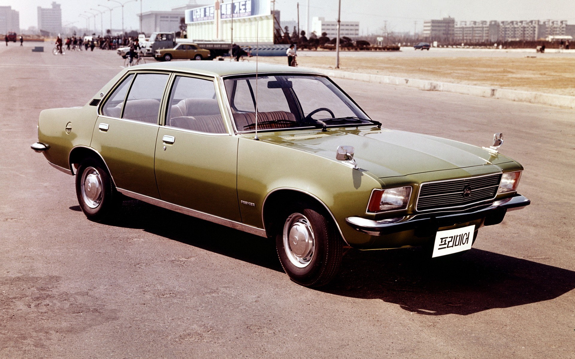 Green sedan car on display