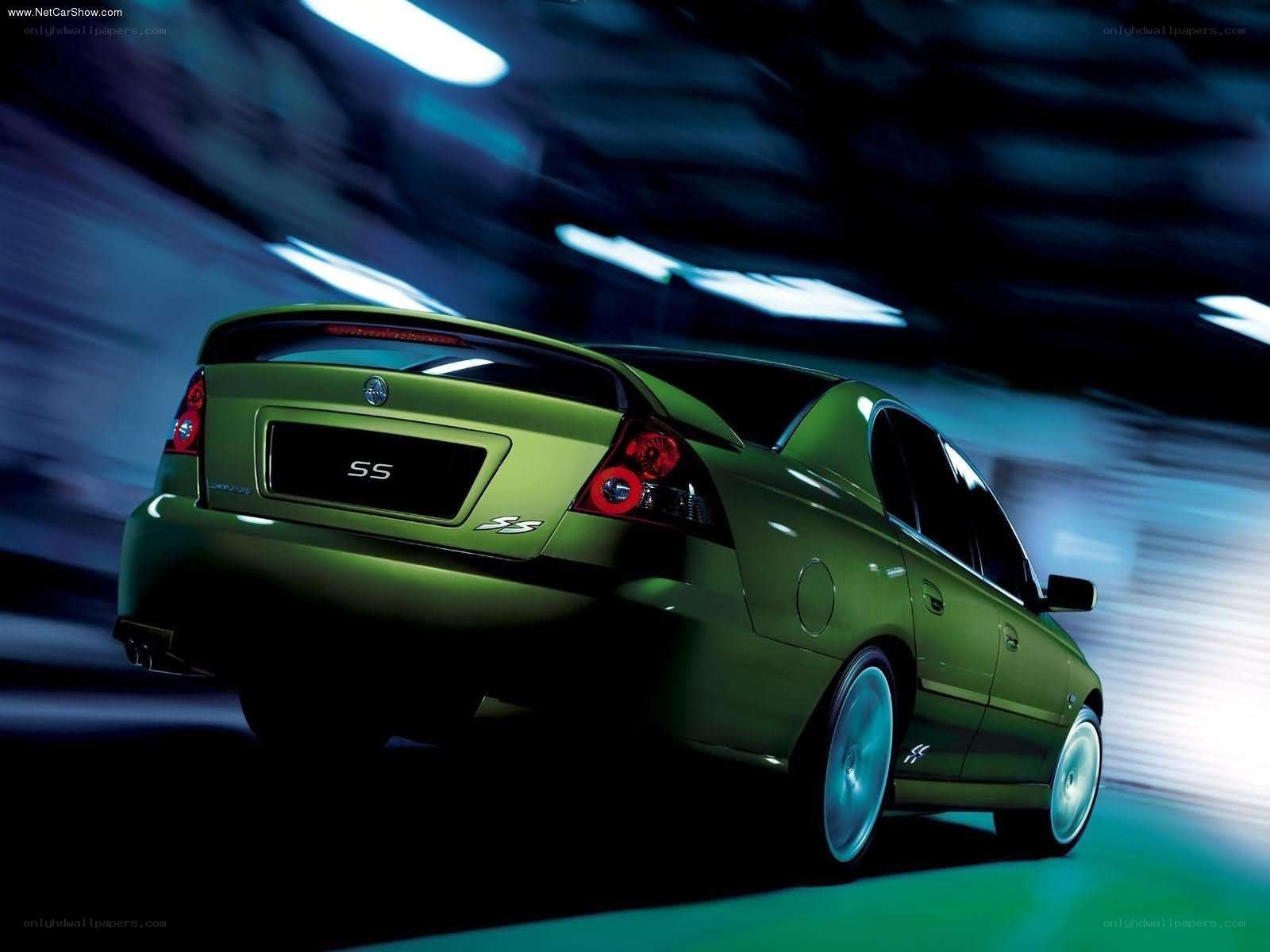 green sedan in motion