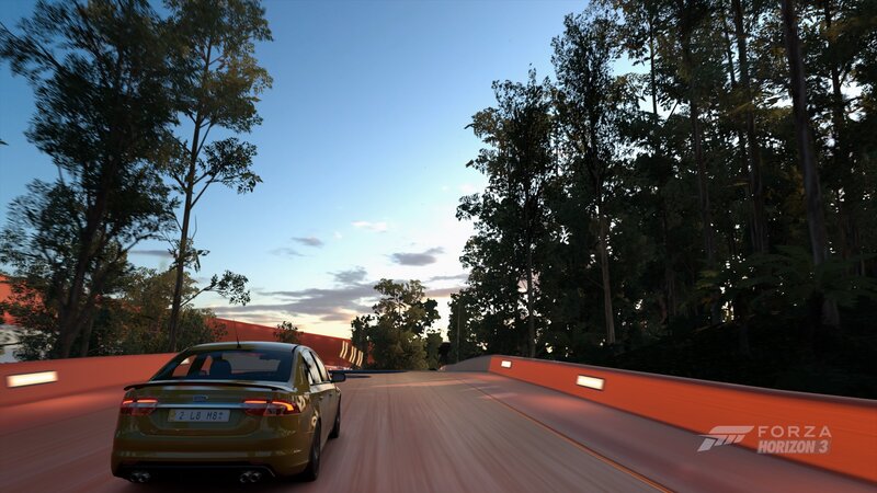 Green Sedan on Bridge