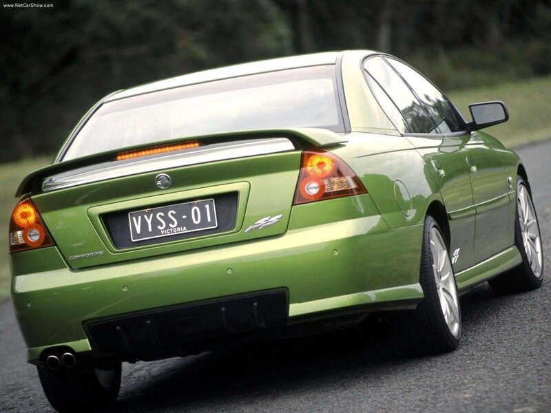 green sedan rear view