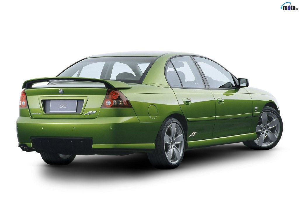 green sedan with spoiler