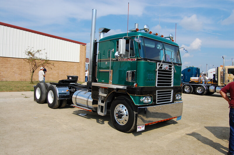 green semi-truck at outdoor show
