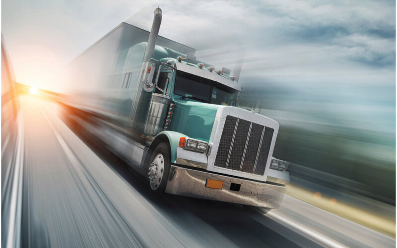 Green Semi-truck on Highway — Dynamic, Morning