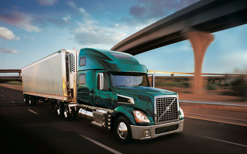Green Semi-truck on Highway — Teal
