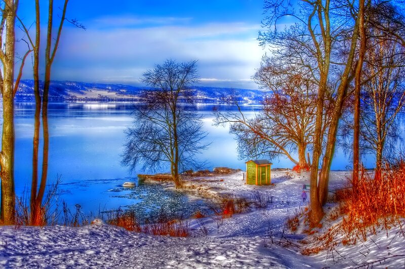 Green Shed on Snowy Shore
