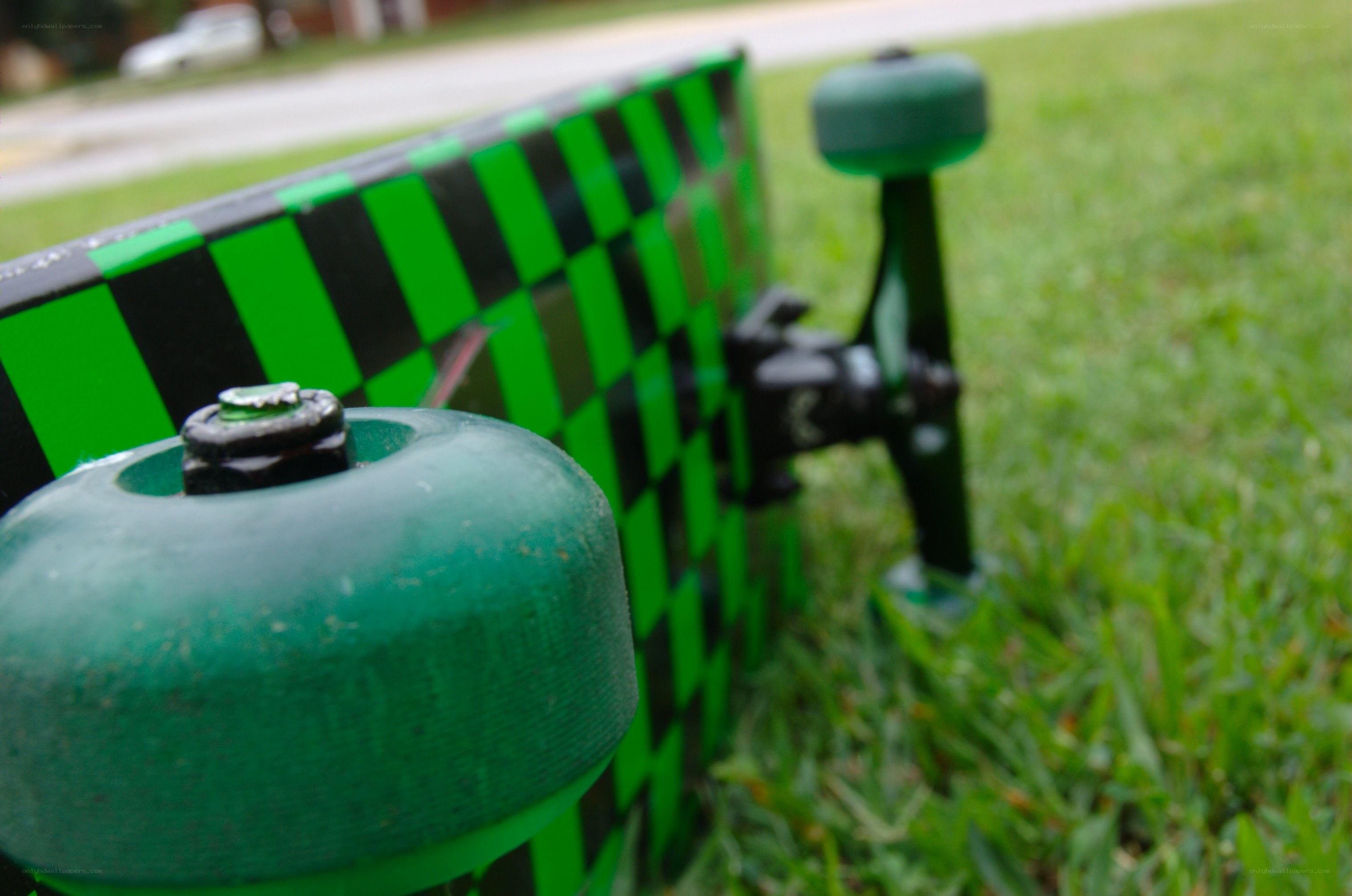 green skateboard on grass