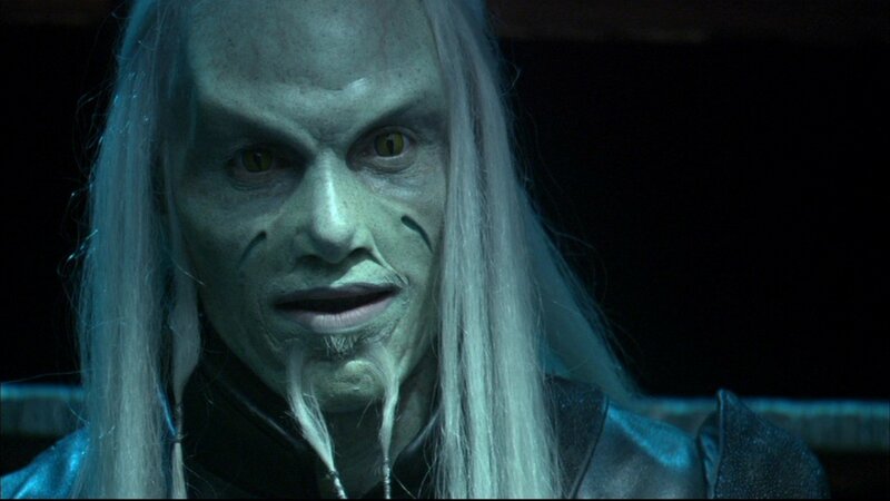 green-skinned character with long white hair
