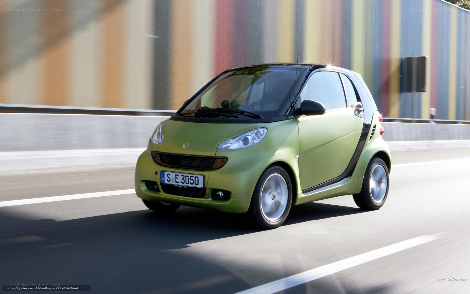 green smart car in motion