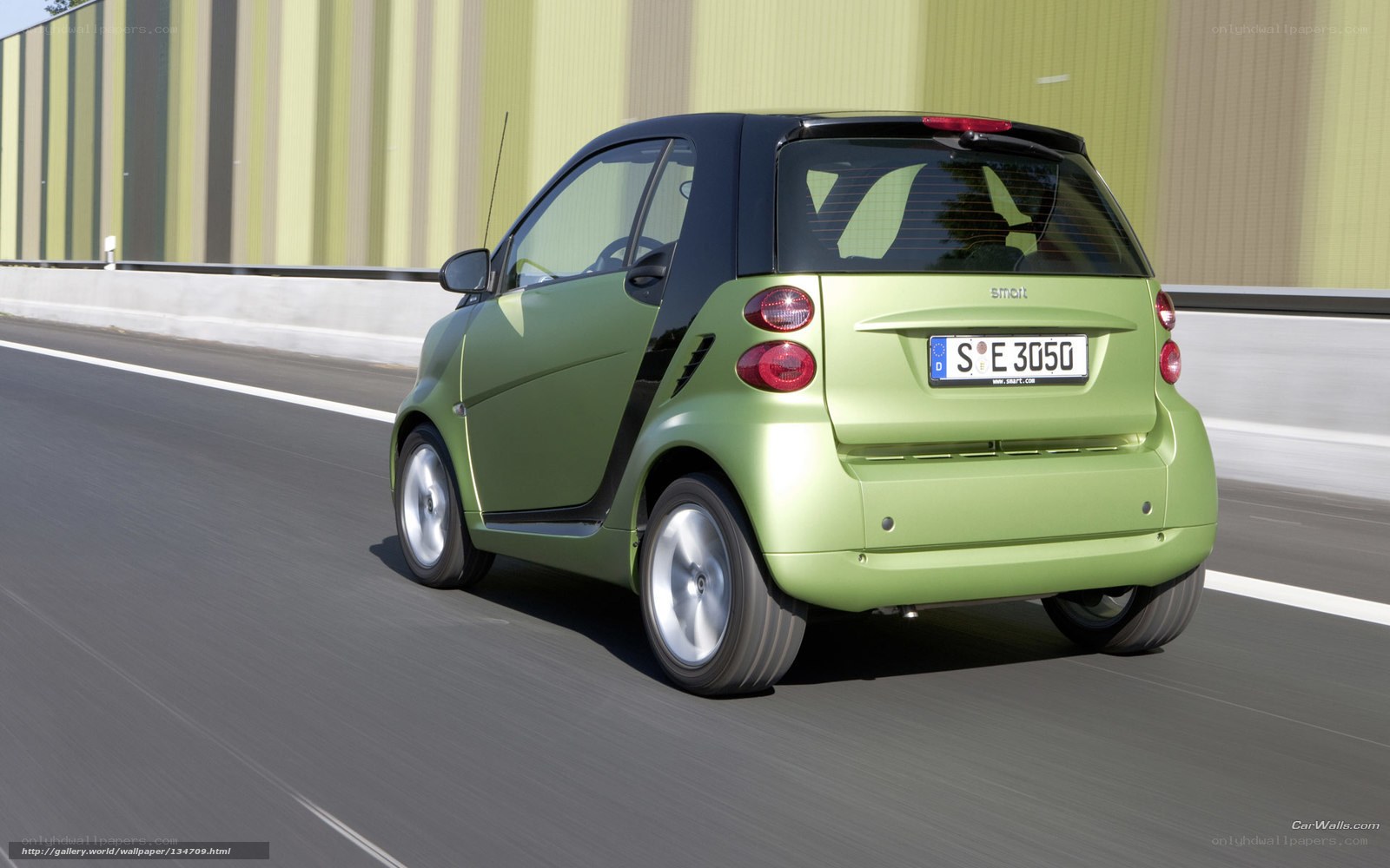 green smart car on road