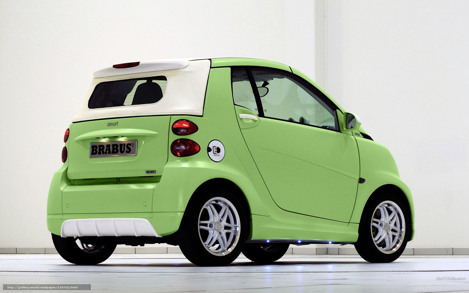 green smart car with brabus badge