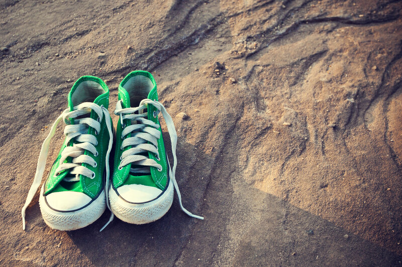 Green Sneakers on Ground