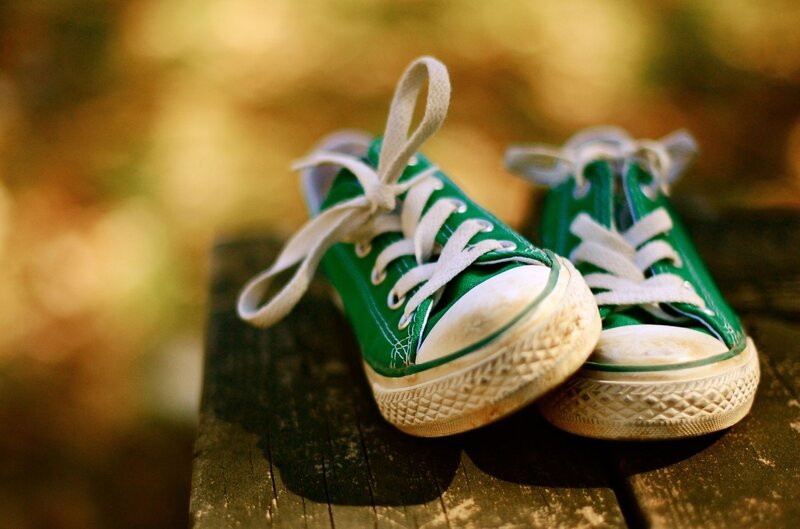 Green Sneakers on Wood