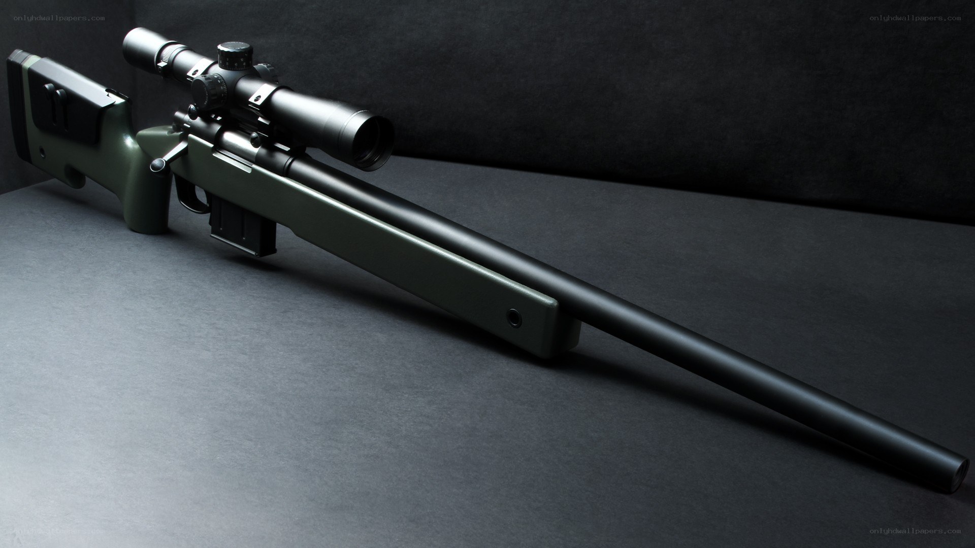 green sniper rifle with scope