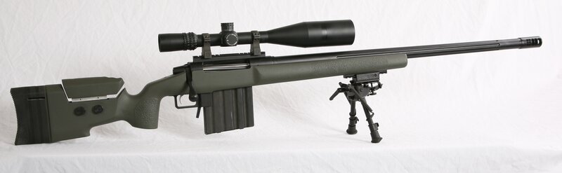 green sniper rifle with scope
