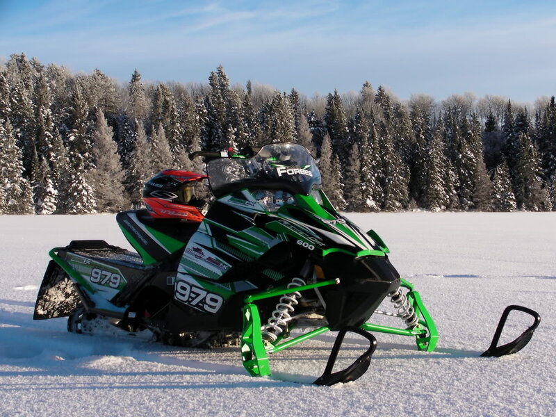Green Snowmobile in Snow — Serene