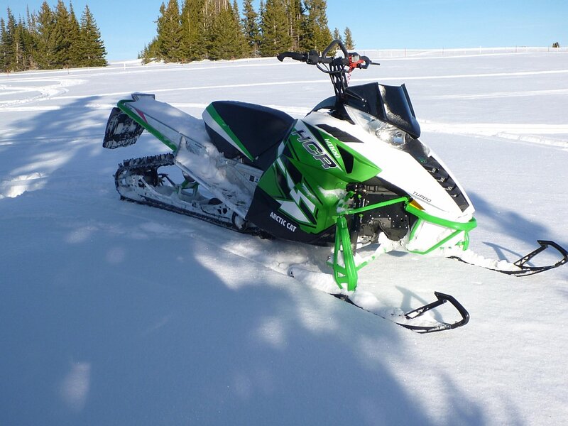 Green Snowmobile in Snow — White