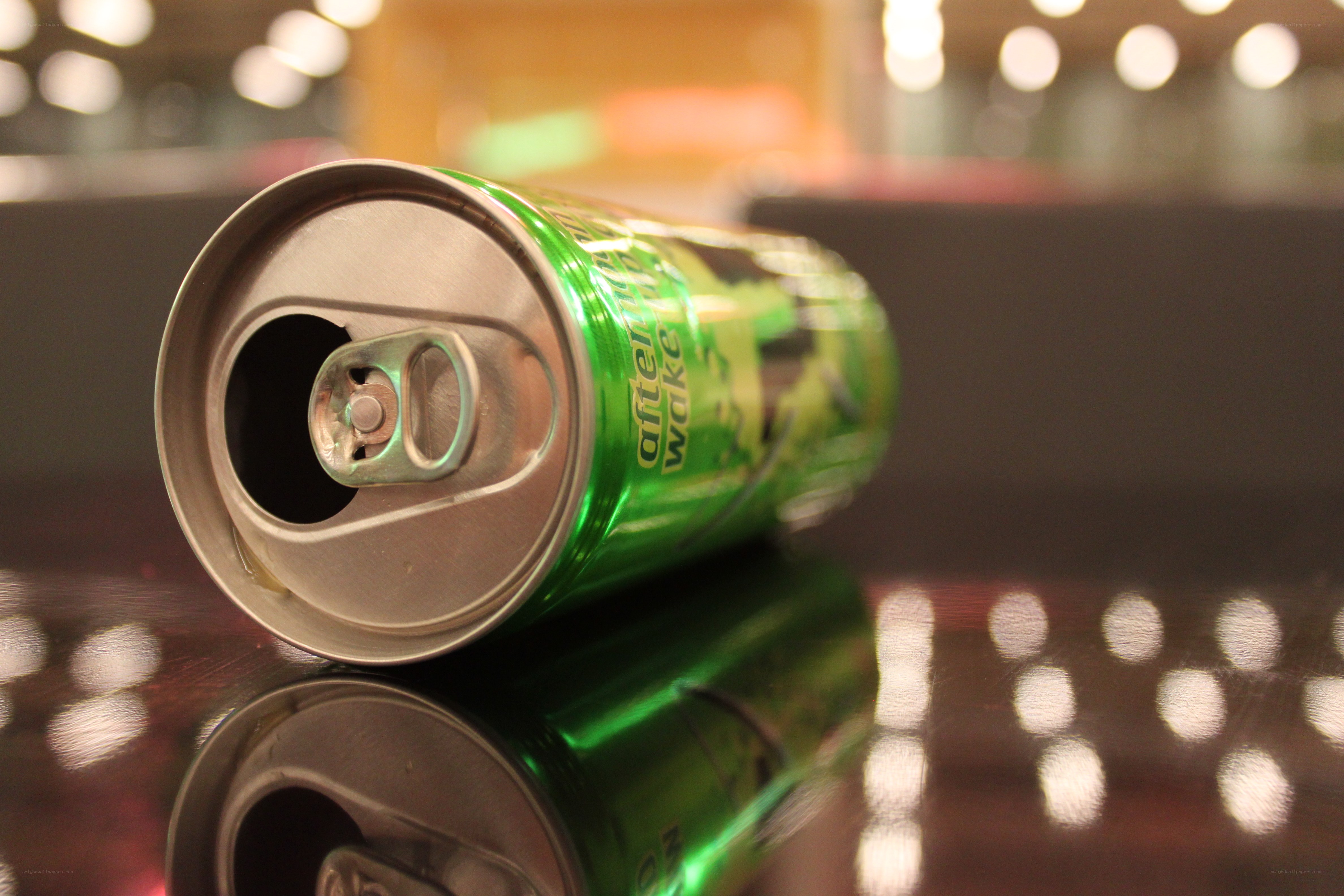 green soda can on table