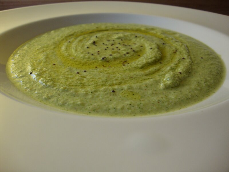 green soup in a white bowl